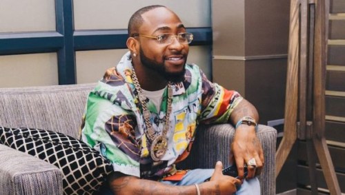 Lady Almost Goes Insane after spotting Davido From ADistance (Video)